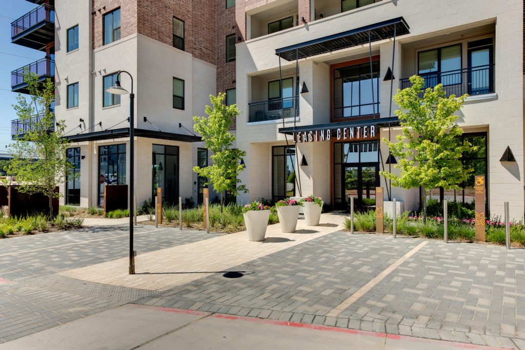 Alternate Exterior outside view of entry to leasing office with gardening areas